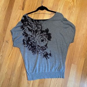 Gray short sleeve sweater with black floral design